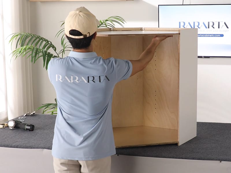 Attach the top and bottom panels of the cabinet