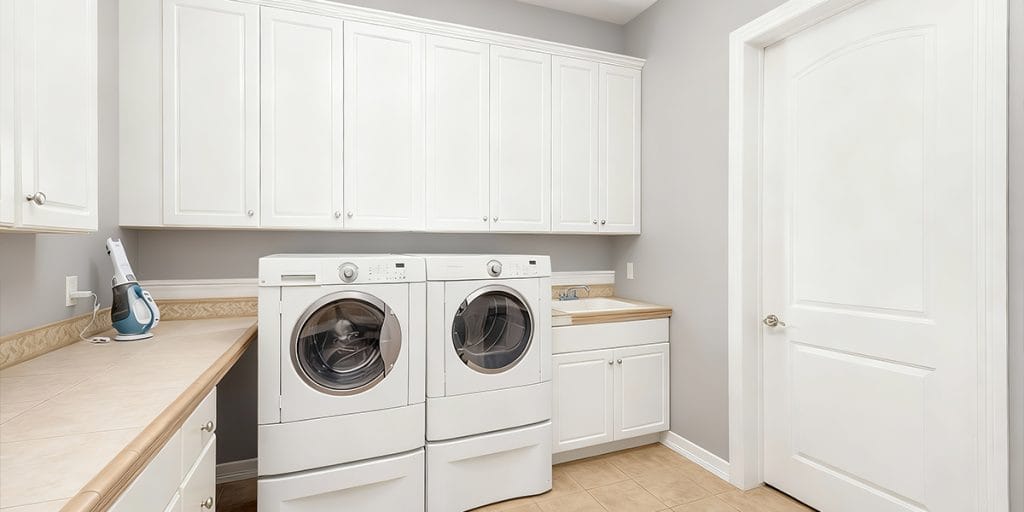 Cabinet - white laundry room shaker cabinets A white laundry room featuring Shaker-style wall cabinets and base cabinets, showcasing practical storage and classic design.